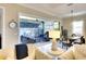 Spacious living room with an open slider to a covered patio, seamlessly blending indoor-outdoor living at 1022 Overlook Ct, Bradenton, FL 34208