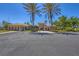 Community center featuring lush landscaping, ample parking, and amenities perfect for social gatherings and events at 1290 Cielo Ct, North Venice, FL 34275