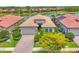 Beautiful single-Gathering home with lush landscaping and a paver driveway, located near a scenic lake at 1290 Cielo Ct, North Venice, FL 34275