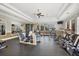 Well-equipped community gym with a variety of modern exercise machines and ceiling fans for a comfortable workout at 1290 Cielo Ct, North Venice, FL 34275