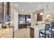 Kitchen features dark wood cabinetry, granite counters, and stainless steel appliances at 1290 Cielo Ct, North Venice, FL 34275