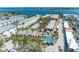 Aerial view of a resort community with a pool, manicured landscaping, and convenient parking at 1325 Gulf Dr N # 247, Bradenton Beach, FL 34217