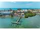 An aerial view of a Gulf Coast waterfront community with private dock access and scenic landscape at 1325 Gulf Dr N # 247, Bradenton Beach, FL 34217