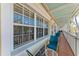 Comfortable condo balcony with seating area, offering a relaxing outdoor space with a view at 1325 Gulf Dr N # 247, Bradenton Beach, FL 34217