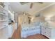 This bedroom includes tiled floors, built-in shelves, and a floral bedspread at 1325 Gulf Dr N # 247, Bradenton Beach, FL 34217