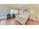 Cozy bedroom with white furniture, tiled floors and bright natural light creating a relaxing atmosphere at 1325 Gulf Dr N # 247, Bradenton Beach, FL 34217