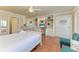 Comfortable bedroom featuring built-in shelving and a desk space, perfect for relaxing or working at 1325 Gulf Dr N # 247, Bradenton Beach, FL 34217
