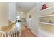 Compact kitchen featuring wooden countertops, white cabinets and a range of appliances at 1325 Gulf Dr N # 247, Bradenton Beach, FL 34217