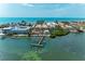 Breathtaking aerial view of waterfront property featuring private dock and stunning ocean view at 1325 Gulf Dr N # 248, Bradenton Beach, FL 34217