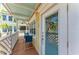 Cozy outdoor balcony with seating, complemented by the building's architecture and natural light at 1325 Gulf Dr N # 248, Bradenton Beach, FL 34217