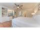 Bedroom features a built-in desk and a ceiling fan at 1325 Gulf Dr N # 248, Bradenton Beach, FL 34217