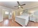 Bedroom features a bed, ceiling fan, and terracotta tile flooring at 1325 Gulf Dr N # 248, Bradenton Beach, FL 34217
