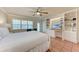 Bedroom features a ceiling fan, terracotta flooring, and a built-in shelf at 1325 Gulf Dr N # 248, Bradenton Beach, FL 34217