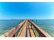 Waterfront property featuring a private wooden dock perfect for boating and enjoying the ocean view at 1325 Gulf Dr N # 248, Bradenton Beach, FL 34217