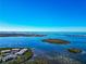 Expansive aerial view of waterfront condos and surrounding scenic landscape at 1389 Perico Point Cir # 140, Bradenton, FL 34209