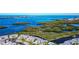 Scenic aerial of waterfront condo community with bays, mangroves, and a pool at 1389 Perico Point Cir # 140, Bradenton, FL 34209