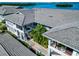 Condominium aerial featuring meticulously maintained buildings with lush landscaping and tranquil water views at 1389 Perico Point Cir # 140, Bradenton, FL 34209