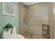 Bathroom featuring a glass enclosed shower, tiled walls and seat on the toilet at 1389 Perico Point Cir # 140, Bradenton, FL 34209