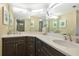 Bathroom featuring a large mirror, double sinks, and contemporary finishes at 1389 Perico Point Cir # 140, Bradenton, FL 34209