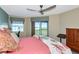 Bedroom featuring a ceiling fan, window with a view, and nice furnishings at 1389 Perico Point Cir # 140, Bradenton, FL 34209
