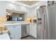 Well-appointed kitchen featuring stainless steel appliances, white cabinetry, and plenty of countertop space at 1389 Perico Point Cir # 140, Bradenton, FL 34209