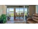 Relaxing screened lanai with outdoor dining set and comfortable seating, offering serene water views at 1389 Perico Point Cir # 140, Bradenton, FL 34209