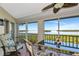Enjoy panoramic water views from this screened lanai featuring a ceiling fan and comfortable seating at 1389 Perico Point Cir # 140, Bradenton, FL 34209