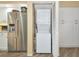 Laundry area featuring modern stacked washer/dryer and ample storage space at 1389 Perico Point Cir # 140, Bradenton, FL 34209