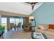Bright living area leads to screened lanai with views of the tranquil water and lush greenery at 1389 Perico Point Cir # 140, Bradenton, FL 34209