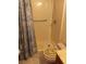 Bathroom view featuring toilet and shower, with beach themed curtain at 1674 University Pkwy # 389, Sarasota, FL 34243