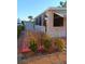 Charming mobile home with a cozy patio and well-maintained landscaping at 1674 University Pkwy # 389, Sarasota, FL 34243