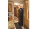 Kitchen view, black refrigerator and wooden cabinets with ample storage space at 1674 University Pkwy # 389, Sarasota, FL 34243