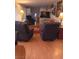 Comfortable living room with hardwood floors, plush chairs, and inviting decor at 1674 University Pkwy # 389, Sarasota, FL 34243