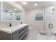 Modern bathroom featuring double vanity, large mirror, and walk-in shower at 1806 Caribbean Dr, Sarasota, FL 34231