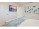 Bright bedroom featuring beach-themed decor, TV, and comfortable bed at 1806 Caribbean Dr, Sarasota, FL 34231