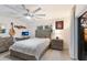 Inviting bedroom features neutral tones, a large ceiling fan, and stylish decor at 1806 Caribbean Dr, Sarasota, FL 34231