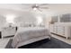 Cozy bedroom featuring shiplap walls, neutral tones, and ample natural light at 1806 Caribbean Dr, Sarasota, FL 34231