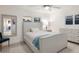 Serene bedroom features neutral decor, shutters, and ample natural light for a peaceful retreat at 1806 Caribbean Dr, Sarasota, FL 34231