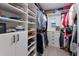 Walk-in closet with custom shelving, drawers, and ample storage space at 1806 Caribbean Dr, Sarasota, FL 34231