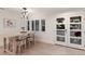 Light and bright dining room features a modern table, stylish chairs, and a contemporary chandelier at 1806 Caribbean Dr, Sarasota, FL 34231