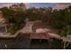 Waterfront lot with wooden dock, perfect for boating and enjoying waterfront living at 1806 Caribbean Dr, Sarasota, FL 34231