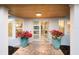 Inviting front entrance with double doors, wood ceiling, and planters, creating a warm, and welcoming curb appeal at 1806 Caribbean Dr, Sarasota, FL 34231