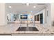 Stylish kitchen offers granite countertops, an undermount sink, and seamless flow into the living spaces at 1806 Caribbean Dr, Sarasota, FL 34231