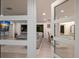 Elegant living room view through glass doors, showcasing the open floor plan, modern decor, and hardwood floors at 1806 Caribbean Dr, Sarasota, FL 34231