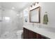Bright bathroom featuring a walk-in shower with marble tile, modern vanity, and sleek fixtures at 200 Gardens Edge Dr # 222, Venice, FL 34285