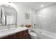 Modern bathroom featuring a vanity with quartz countertop and a tub with shower at 200 Gardens Edge Dr # 222, Venice, FL 34285