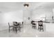 Open-concept dining room with a ceiling fan and table for four at 200 Gardens Edge Dr # 222, Venice, FL 34285