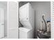 Laundry room with a stackable washer and dryer at 200 Gardens Edge Dr # 222, Venice, FL 34285