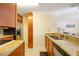 Traditional kitchen featuring granite counters, stainless steel appliances, and light brown cabinetry at 2121 Wood St # 221, Sarasota, FL 34237