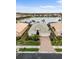 Aerial view of a home with meticulous landscaping and a brick paver driveway at 2183 Nettlebush Ln, Venice, FL 34292
